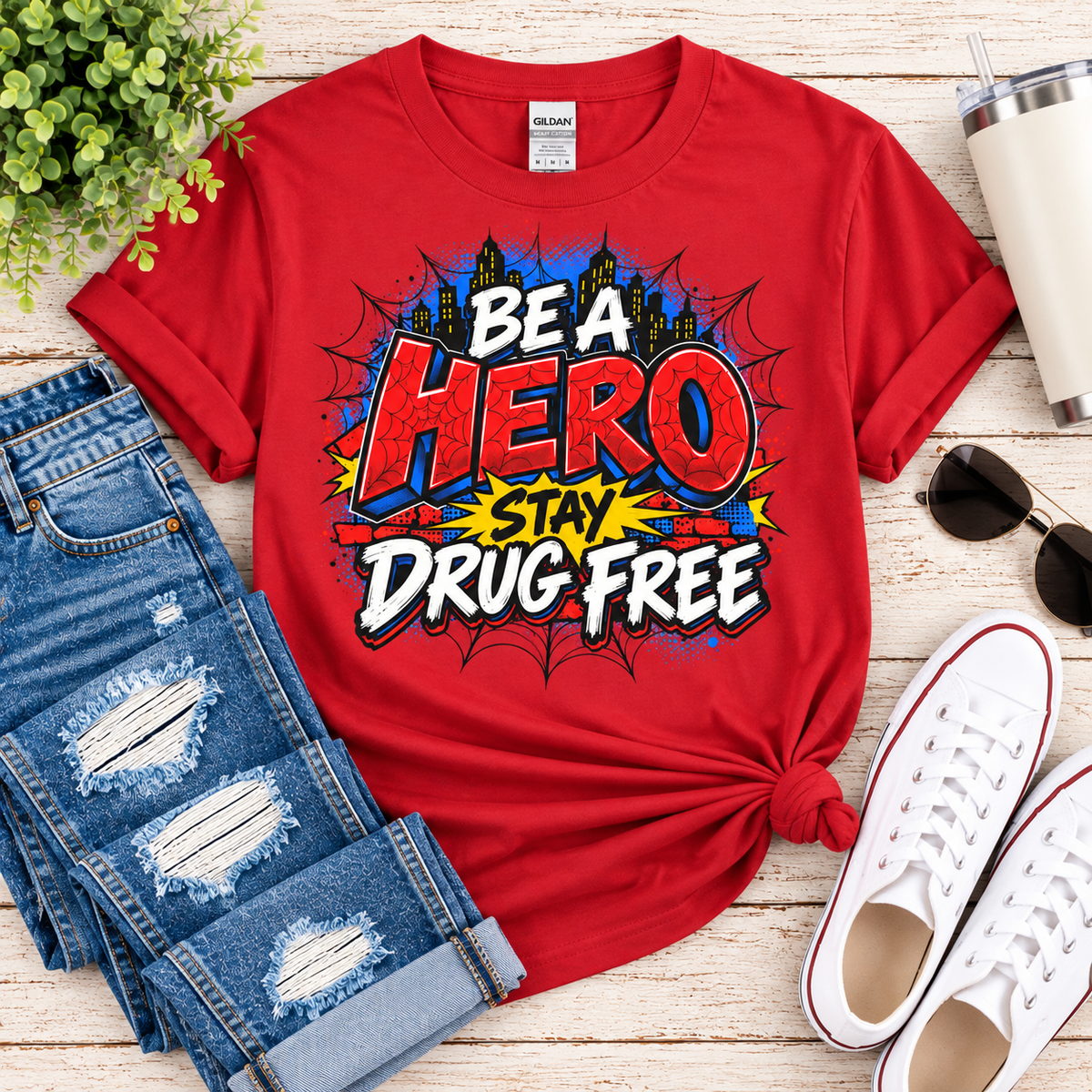 Red Ribbon Week teacher shirt - spider web Be a Hero Stay Drug Free superhero design on red Gildan Softstyle tee - flat lay outfit photo
