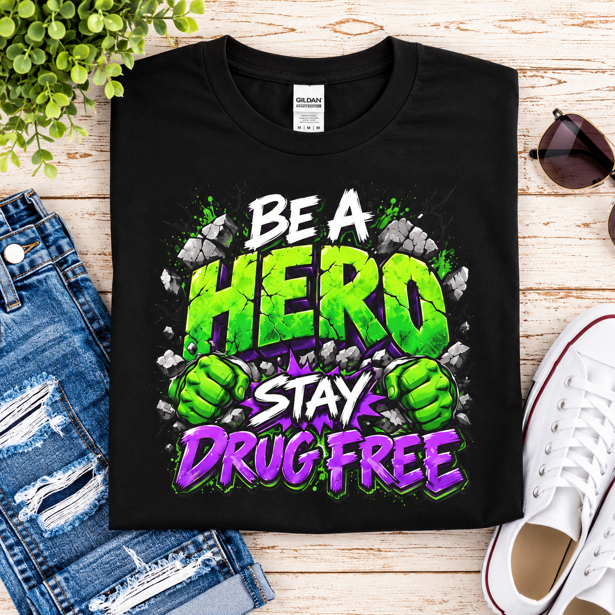 Red Ribbon Week teacher shirt - green smash Be a Hero Stay Drug Free superhero design on black Gildan Softstyle tee - flat lay close-up