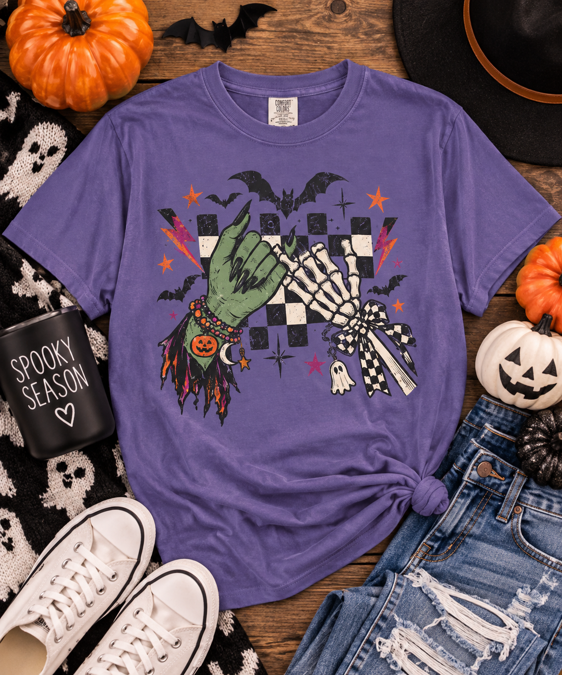Halloween Pinky Promise shirt flat lay in Grape with retro spooky hand graphic.